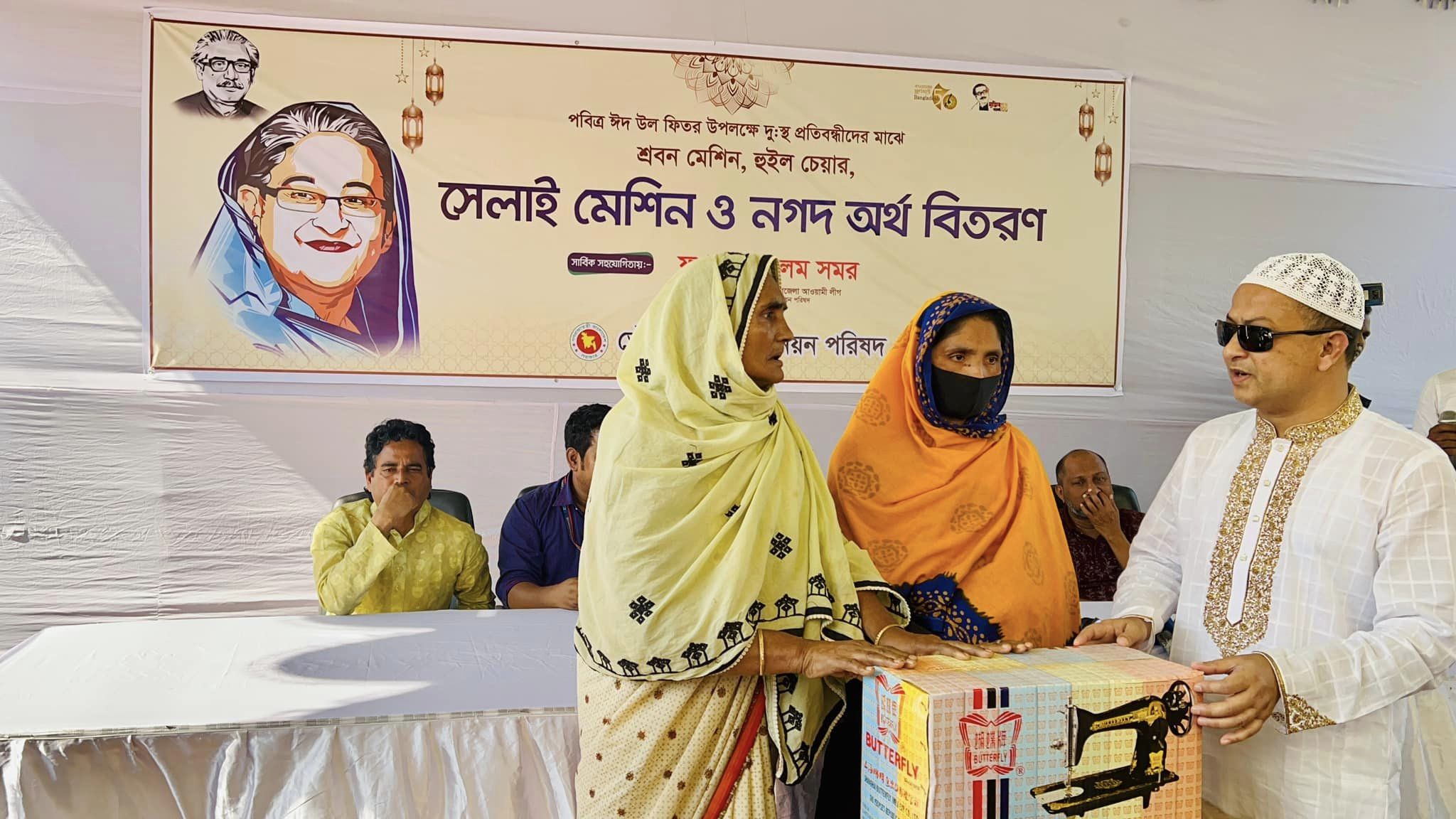 সাভারে দু:স্থ প্রতিবন্ধীদের মাঝে শ্রবন মেশিন, হুইল চেয়ার, সেলাই মেশিন ও নগদ অর্থ বিতরণ